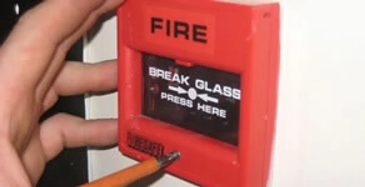 fire alarm installation service showing manual fire alarm pull station installed by licensed electricians in Peoria, IL