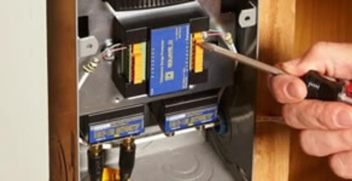 Whole home surge protection device being installed by a licensed electrician to protect electrical systems in Peoria, IL